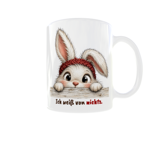 Weiße Tasse mit niedlichem Hasen, rotem Strickstirnband und Spruch „Ich weiß von nichts.“